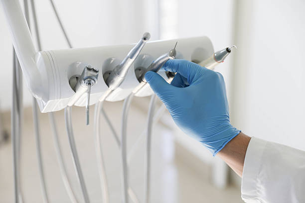 Professional Tooth Extraction technician working in Louisa County County, VA